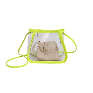 Transparent PVC tote bag with neon yellow trim and drawstring canvas insert bag