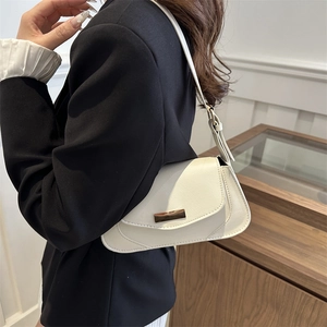 Minimalist beige leather baguette shoulder bag with classic bronze buckle for women