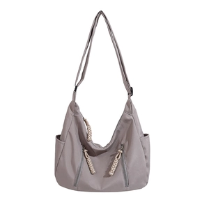 Large gray canvas tote bag with half-moon shape and adjustable strap for crossbody use