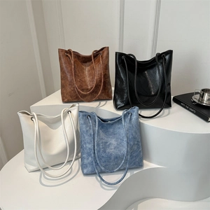 Minimalist soft leather tote bags in brown black white and blue denim styles