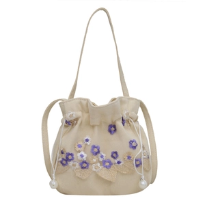 Sac seau en toile brodée avec dentelle florale 3D et fermeture à perles