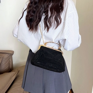 Chic black rhinestone shell crossbody bag with gold metal handle and chain strap for women