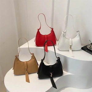 Minimalist crescent underarm bags in red, white, brown and black with gold accents
