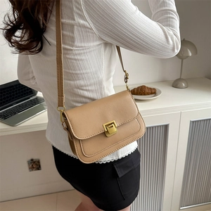 Chic khaki faux leather crossbody square bag with gold buckle on casual model