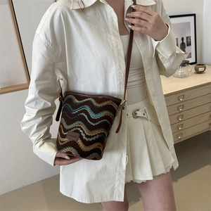 Fashionable jacquard bucket bag with colorful wave patterns and slim leather strap