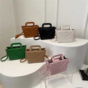 Minimalist geometric square handbags in six colors featuring top handles and shoulder straps