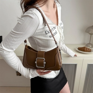 Minimalist coffee brown crescent underarm bag with large silver square buckle detail