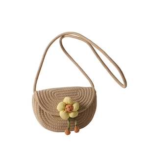 Handwoven cotton cord shoulder bag with yellow floral accent for summer beach vacations