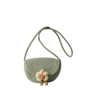 Handwoven green floral cotton saddle bag with crossbody strap for beach vacation