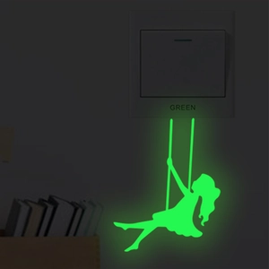 Luminous girl on swing wall sticker glowing green in dark around light switch