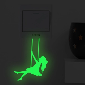 Luminous wall sticker showing a girl silhouette swinging in green glow at night