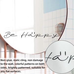 Detail of Be Happy mirror decal showing electrostatic cling texture on glass