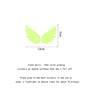 Glow in the dark wing-shaped wall stickers with detailed dimensions and application guide