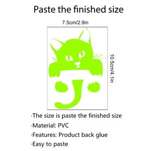 Macro shot of luminous green PVC cat wall sticker with dimensions 7.5cm by 10.5cm