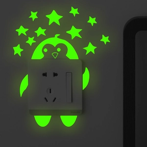 Luminous penguin and stars wall stickers glowing in dark on light switch