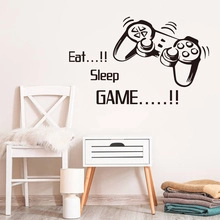 Macro detail of 'Eat Sleep Game' PVC wall decal with gamepad illustration for game rooms