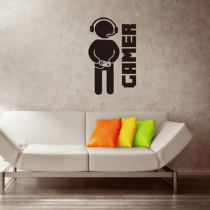 Dettaglio di un adesivo murale gamer nero in stile pixel art su una parete grigia