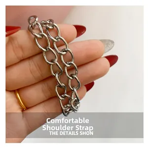 Close-up of a silver metal chain strap with flat links for a stylish saddle bag