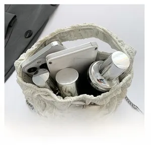 Internal view showing the spacious capacity of this white drawstring bucket bag