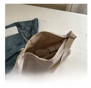 Interior view showing the large storage capacity of the nylon crossbody dumpling bag