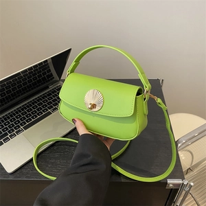 Modern lime green leather underarm bag with gold shell buckle and slim shoulder strap