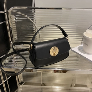 Elegant black underarm bag for women with gold scalloped metal lock and shoulder strap
