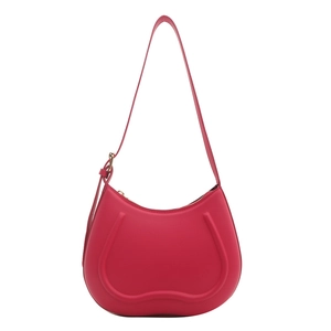 Chic rose pink half-moon shoulder bag with sleek U-shaped embossed lines and gold hardware