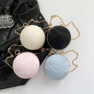 Spherical evening clutch bags with marble texture and gold chain strap in four colors