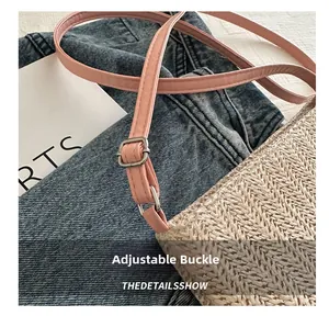 Detail of adjustable pink strap with silver buckle on woven tote bag with macro shot