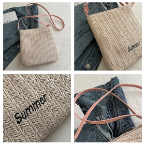 Detailed view of beige straw tote featuring Summer embroidery and pink leather strap
