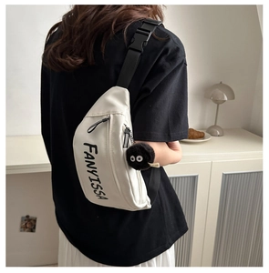 White nylon fanny pack with black FANYISSA logo and a fuzzy coal sprite charm detail