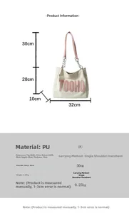 Detailed view of the white PU tote bag with pink straps and metallic chain decorations