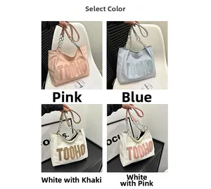 Collage showing four colors of large canvas tote bags with TOOHO lettering and chain strap