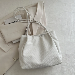 Chic off-white woven tote bag for women featuring premium braided rope handles and texture