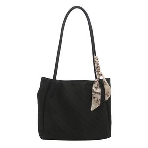Chic black large-capacity tote bag with textured fabric and vintage chain silk scarf detail