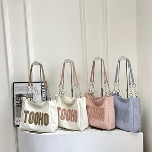 Large casual canvas tote bag with metal chain handles and TOOHO lettering in four colors