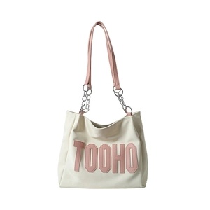 White leather tote bag with pink TOOHO letter patches and metal chain strap
