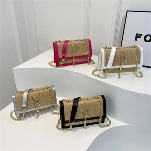 Woven straw crossbody bags with leather trim and gold chain straps in four colors