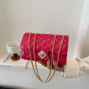 Rose pink quilted crossbody bag with gold clover lock and chain strap for women