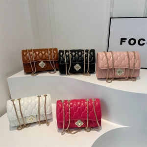 Quilted crossbody bag with chain strap and clover lock in multiple elegant colors