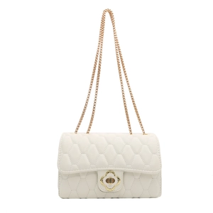 Chic beige quilted diamond crossbody bag with gold chain strap and clover twist lock