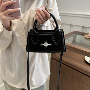 Chic black minimalist square handbag with silver star detail and crossbody strap