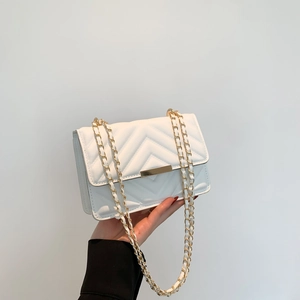 White quilted leather crossbody bag with V-stitch pattern and gold chain strap