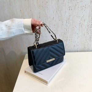 Chic black quilted crossbody bag with golden V-stitch pattern and chain strap