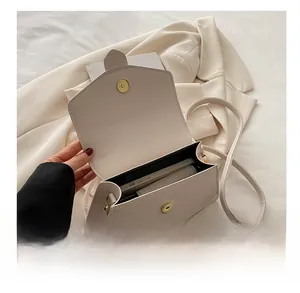 Internal capacity of beige lychee leather crossbody bag showing space for a smartphone