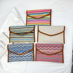 Ethnic striped woven envelope clutches with leather trim in five various artistic patterns