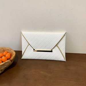 Minimalist white envelope clutch bag with woven texture and gold metal trim details