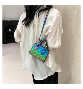 Side view of a quilted gradient crossbody bag on a model showing modern style