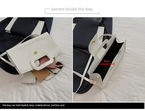 Detail view of large white crocodile pattern handbag showing spacious main compartment