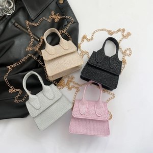Mini sequined handbags in beige, black, silver, and pink with golden chain straps